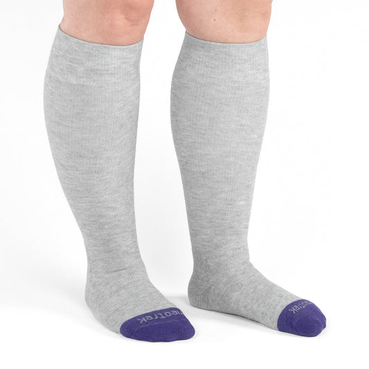 knee high compression socks 15-20 mmHg for circulation support shown on both legs front view